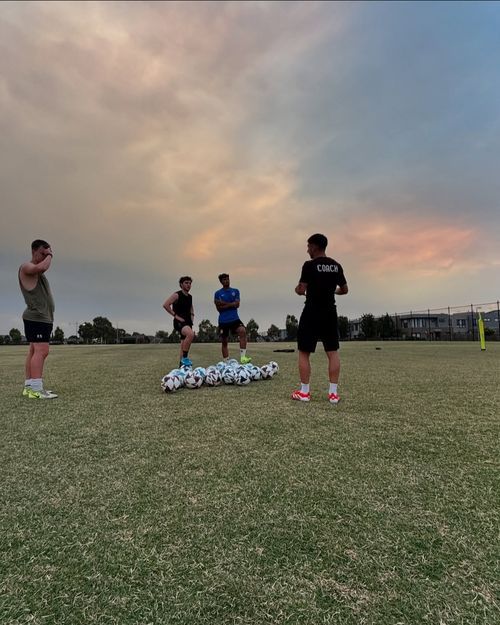 Coach Chris training with senior players during off-season conditioning